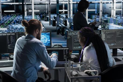 Teamworking server farm colleagues deploying AI tools to automate repetitive workflows. Team of data center engineers managing datasets used in artificial intelligence training, streamlining tasks photo