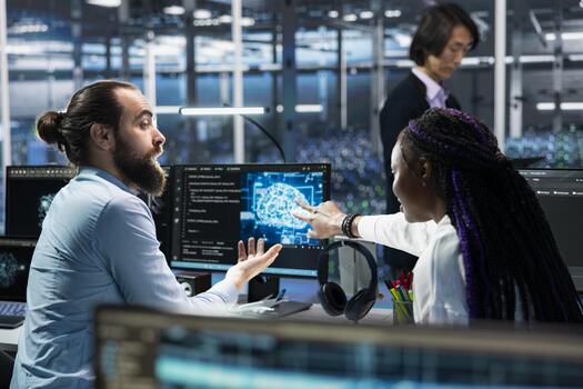 Teamworking programmers in data center troubleshoot server connectivity issues using AI. Colleagues working together in server room auditing systems for vulnerabilities using artificial intelligence photo