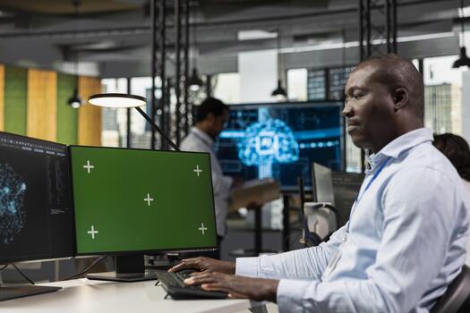 Green screen PC used by programmer in startup company office testing AI machine learning algorithms. IT expert scaling productivity with artificial intelligence technology on mockup computer photo