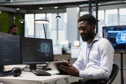 ingeniero en moderno oficina utilizando ai herramientas a automatizar rutina codificación tareas, revisando manual instrucciones. eso experto leyendo portapapeles notas, utilizando artificial inteligencia a acelerar desarrollo foto