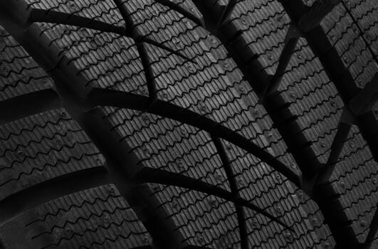 Close up view of an all weather tire tread pattern designed for better traction and performance photo