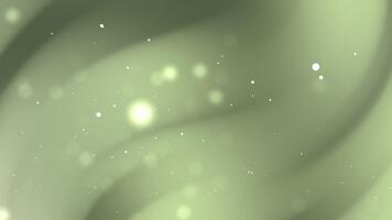 mjuk abstrakt bakgrund terar slät grön gradienter med flytande ljus partiklar och bokeh glöd. video