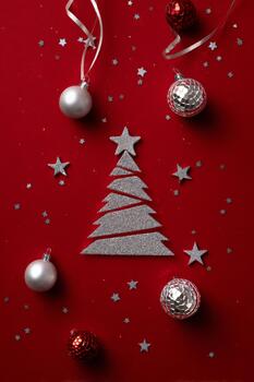 Vertical red backdrop featuring a stylized Christmas-tree shape created with photo