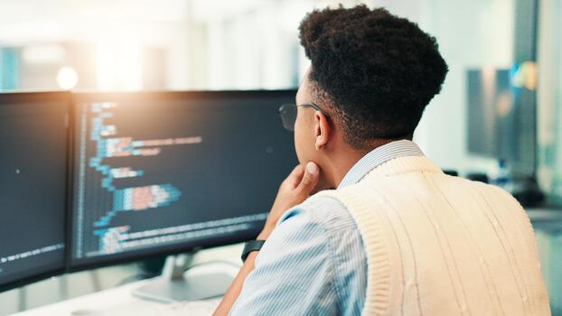 Coding, man and computer screen with thinking in office for programming solution, app development and debugging. Back, coder and data analytics for software testing, system update and problem solving photo