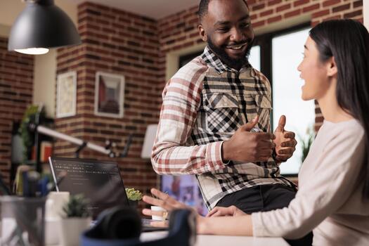 IT engineers couple developing encryption code on laptop, using terminal window with html script and binary code. Programming online application cloud server with firewall security. photo