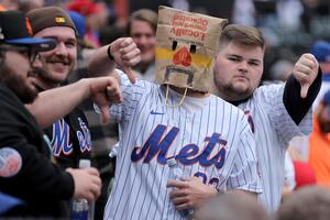 Fans react after the game between the New York Mets and Washington Nationals at Citi Field. - Editorial Image
