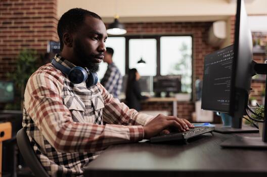 Freelance coder typing javascript code on computer to develop online cloud computing information. Software developer writing html script and data algorithm, working in it programming office. photo