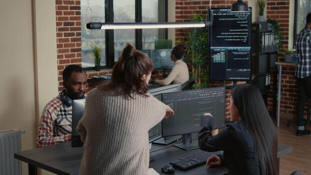 Software developer manages coding workflow inside an IT agency, linking software engineering, data processing and office technology, while examining interface behavior. video