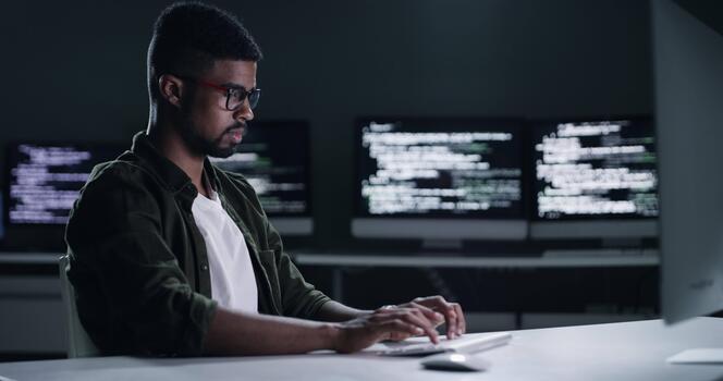Coding, computer and man typing software engineering, cloud computing code or online algorithm. Night developer, cybersecurity expert or programmer working late on script, HTML or programming project video