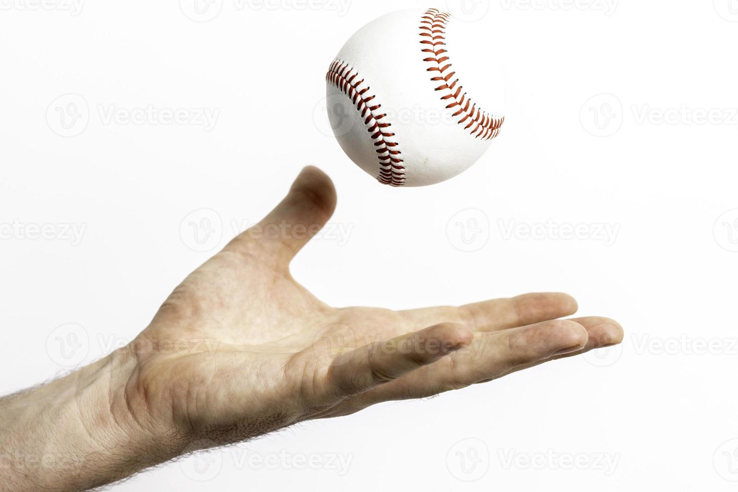 lancio di baseball in aria foto
