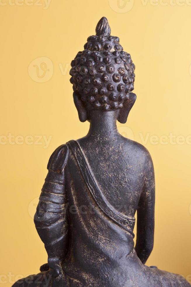 Buddha seduto di pietra indietro foto