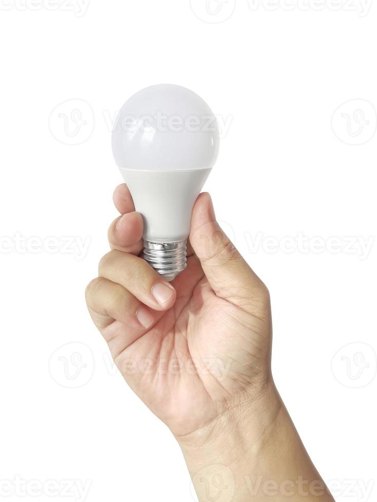 umano mano Tenere un' leggero lampadina su un' bianca sfondo foto