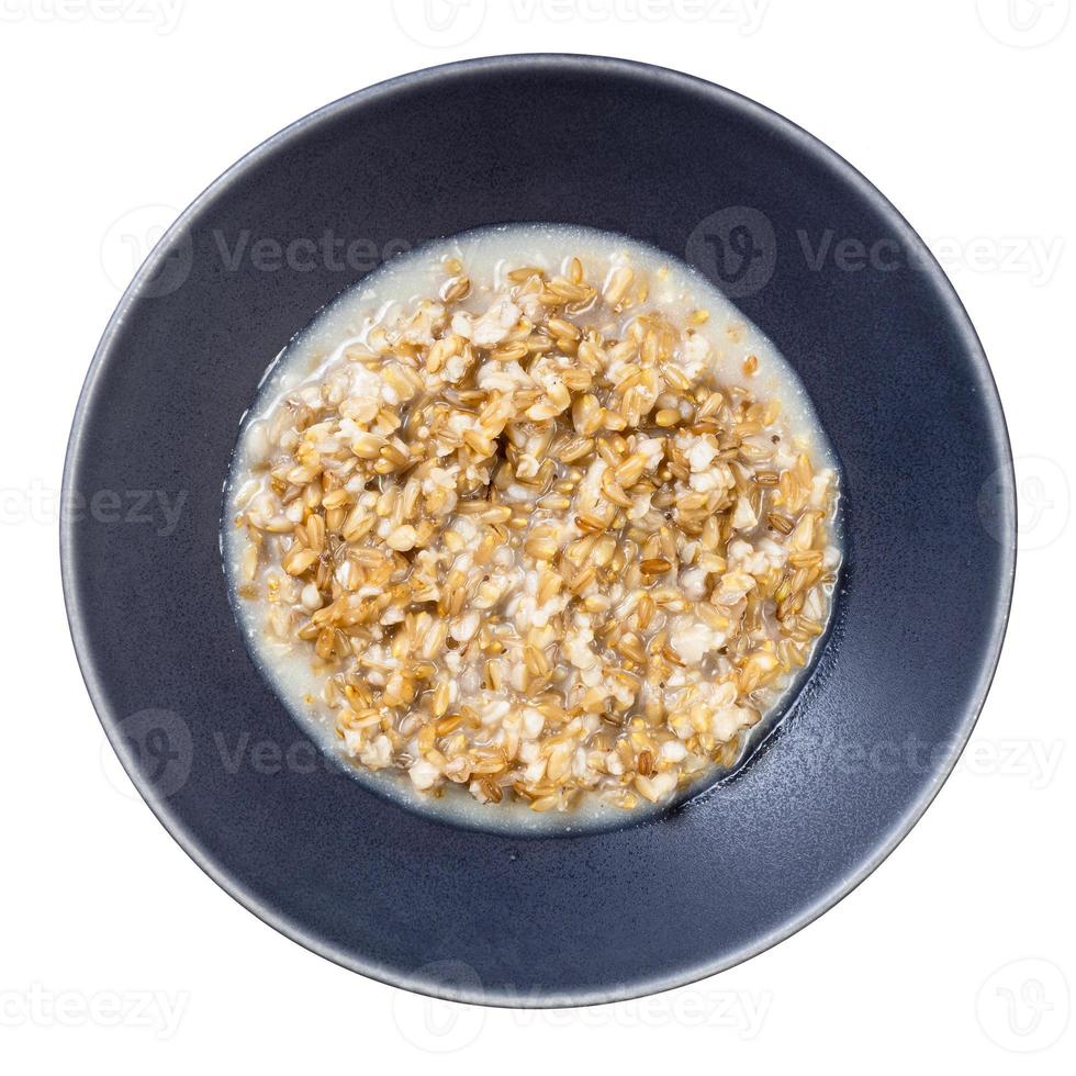 cucinato porridge a partire dal grano intero avena nel grigio ciotola foto