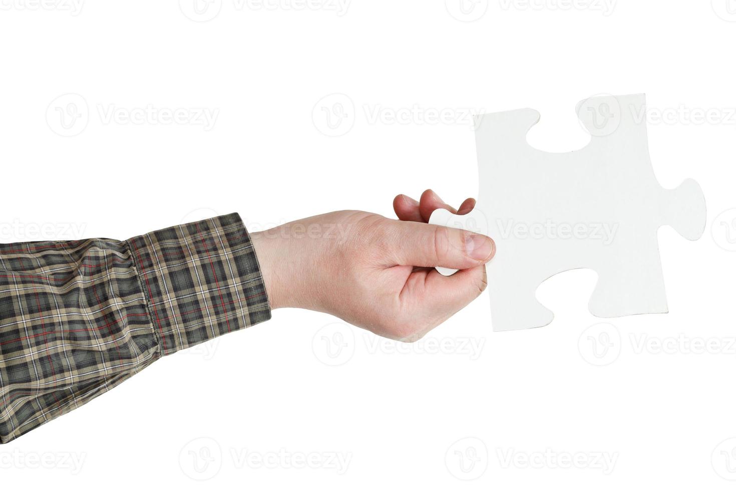 maschio mano Tenere grande bianca carta puzzle pezzo foto