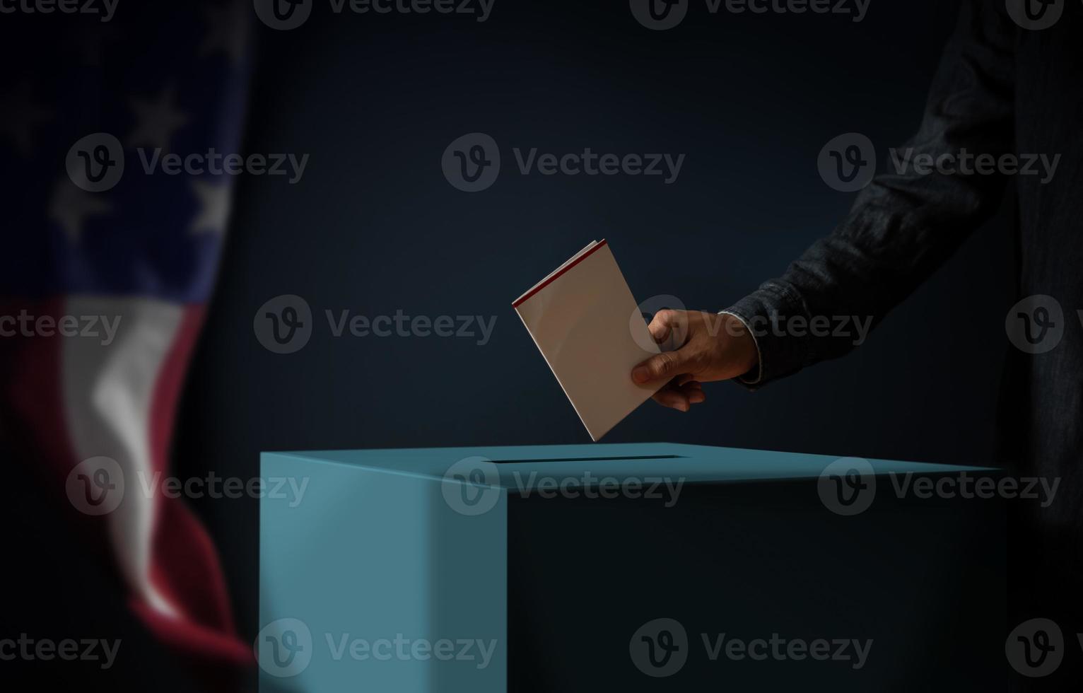 elezione giorno nel unito stati di America concetto. persona lancio un' scrutinio carta in il votazione scatola. Stati Uniti d'America bandiera sospeso su il parete. buio cinematico tono foto