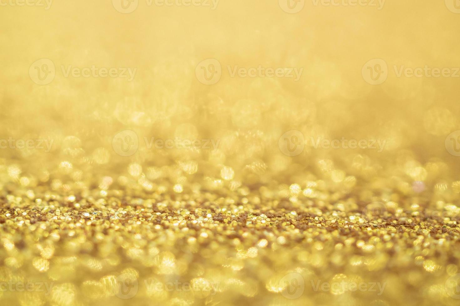 astratto glitter oro festivo natale texture sfocatura dello sfondo con luce bokeh foto