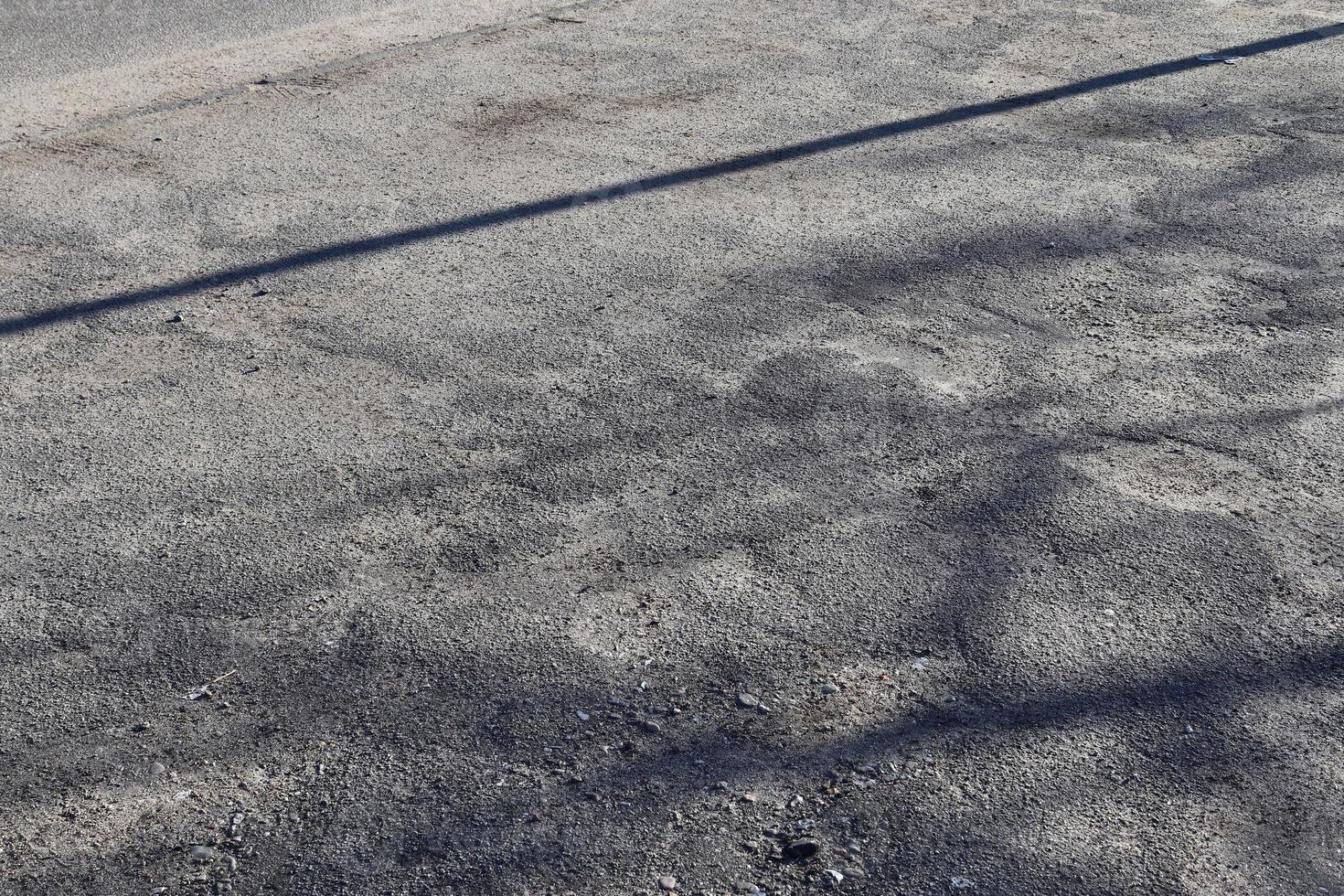 dettagliato Visualizza su asfalto superfici di diverso strade e strade con crepe foto