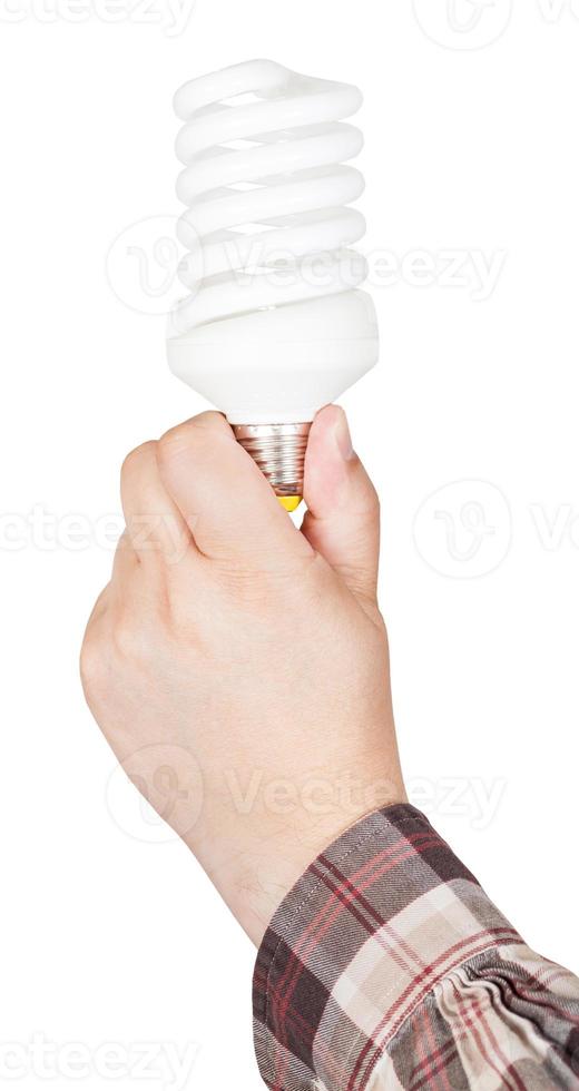mano detiene compatto fluorescente lampada foto