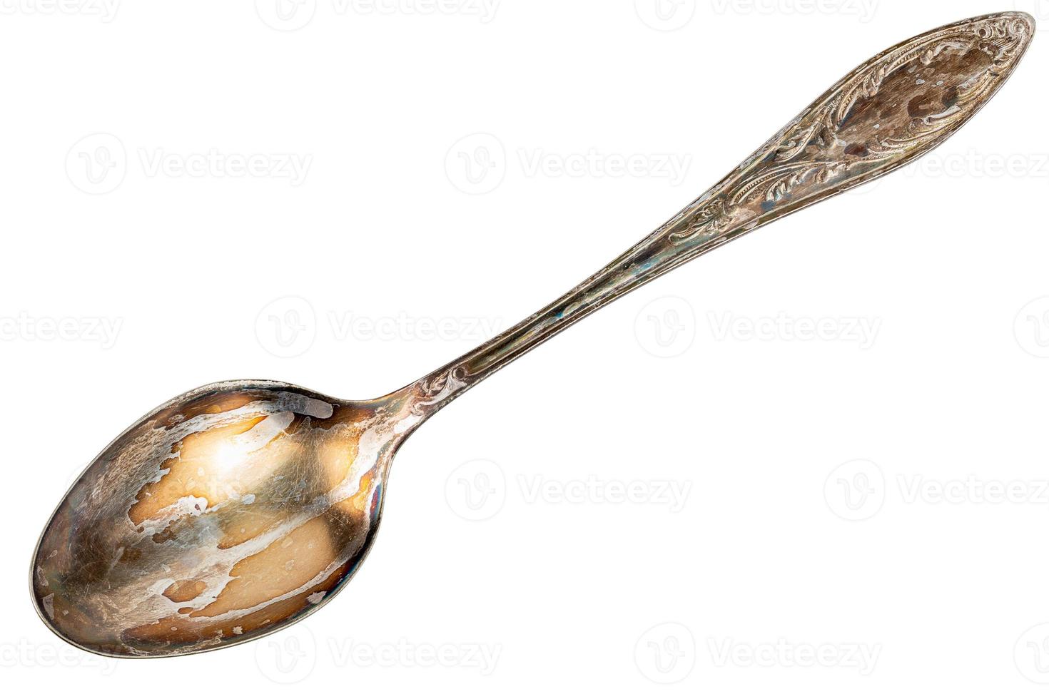 vecchio cupronichel cucchiaio con visibile ossidazione strato isolato su bianca sfondo foto