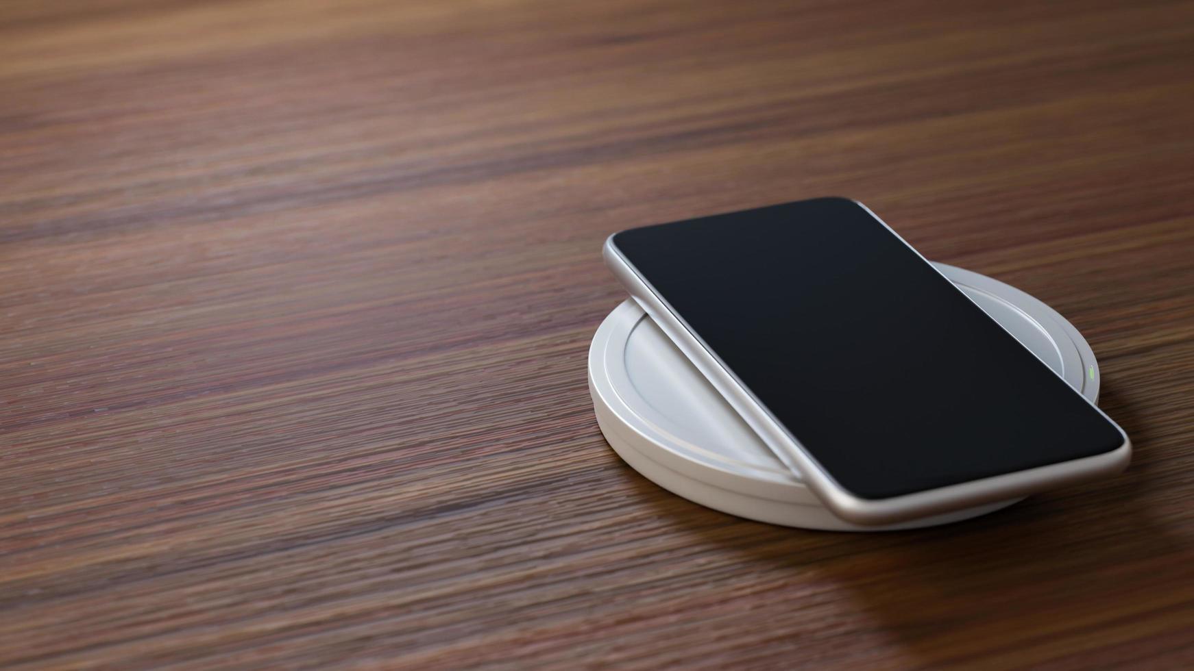 smartphone sul tavolo di legno foto