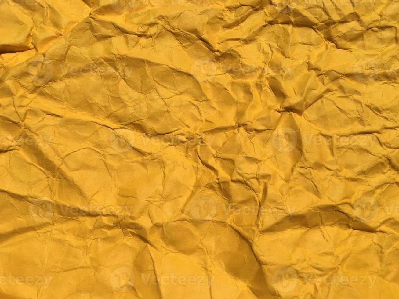 astratto struttura di giallo rugosa carta sfondo per design. copia spazio per testo o opera foto