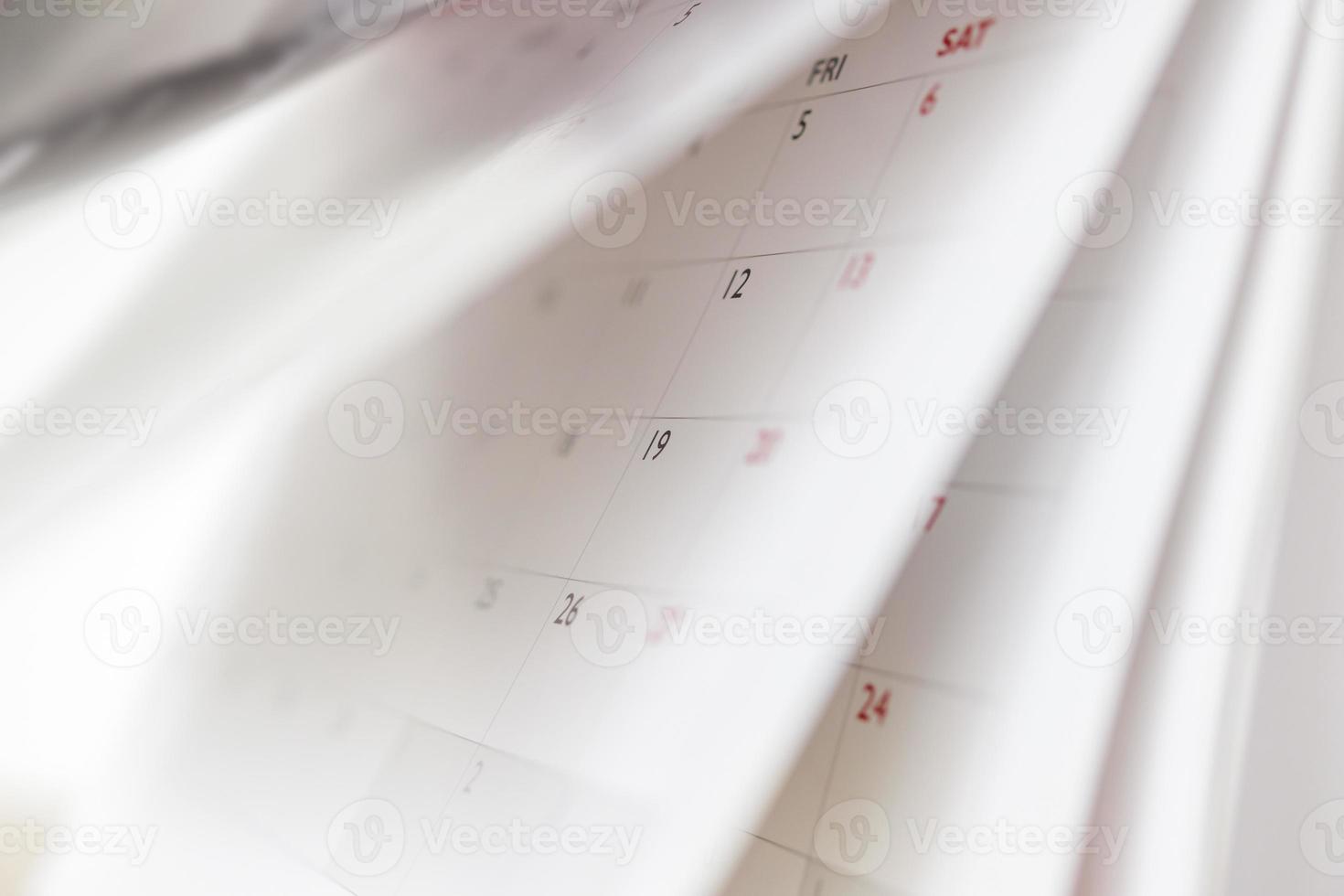 calendario pagina capovolgimento foglio vicino su sfocatura sfondo attività commerciale programma pianificazione appuntamento incontro concetto foto