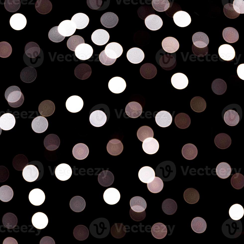 astratto leggero bokeh come sfondo sfocato e sfocato molti il giro leggero su nero sfondo foto