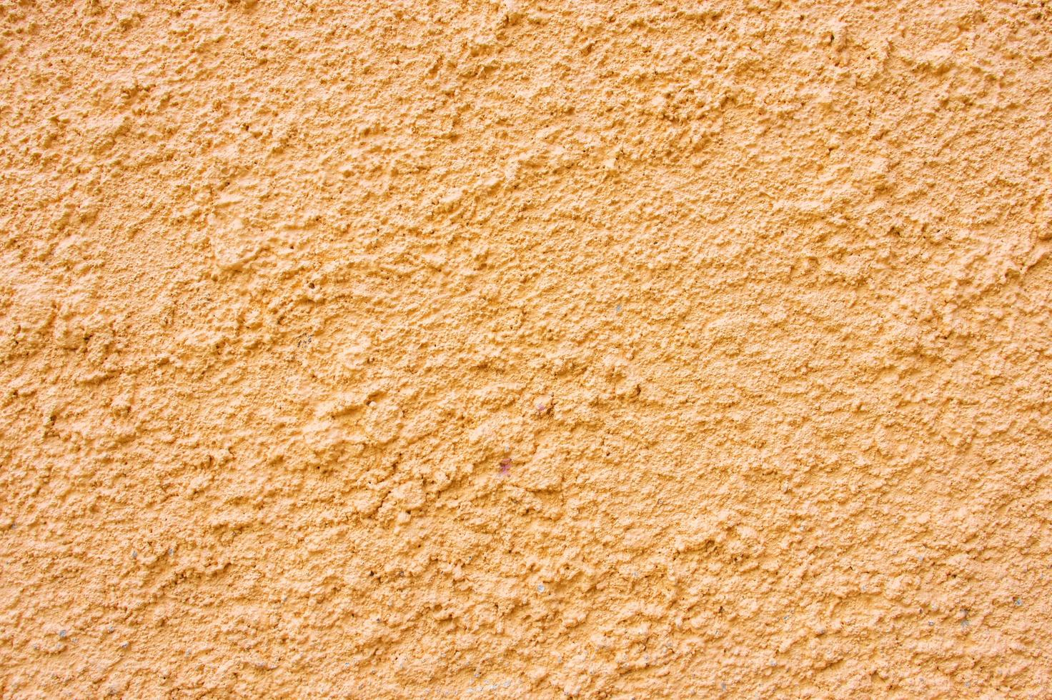 muro di stucco arancione foto