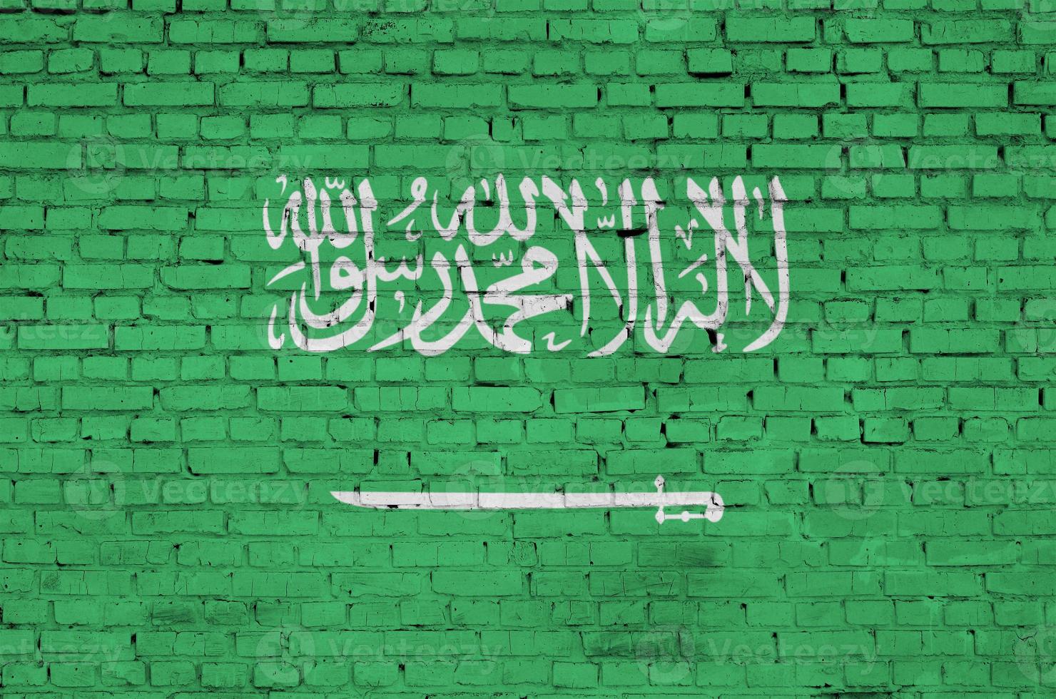 Arabia arabia bandiera è dipinto su un vecchio mattone parete foto