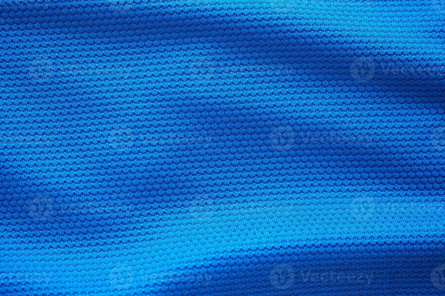 blu calcio maglia capi di abbigliamento tessuto struttura gli sport indossare sfondo, vicino su superiore Visualizza foto