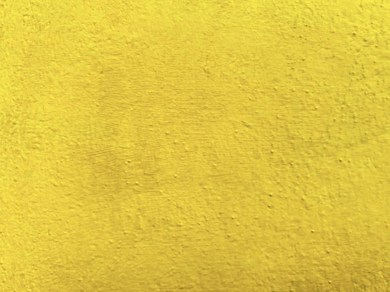 senza soluzione di continuità struttura di giallo cemento vecchio parete un' ruvido superficie, con spazio per testo, per un' sfondo. foto