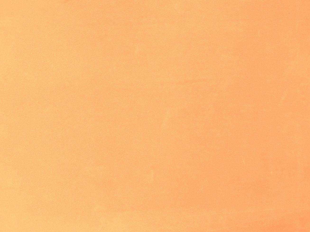 arancia velluto tessuto struttura Usato come sfondo. vuoto arancia tessuto sfondo di morbido e liscio tessile Materiale. Là è spazio per testo. foto