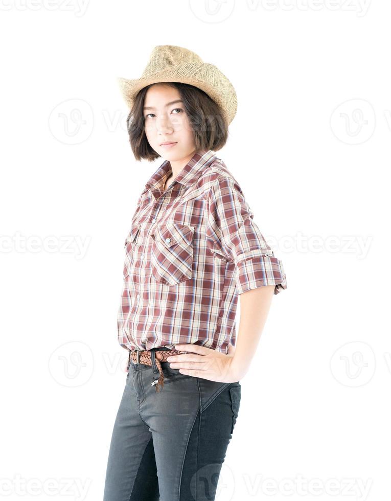 giovane donna nel un' cowboy cappello e plaid camicia foto