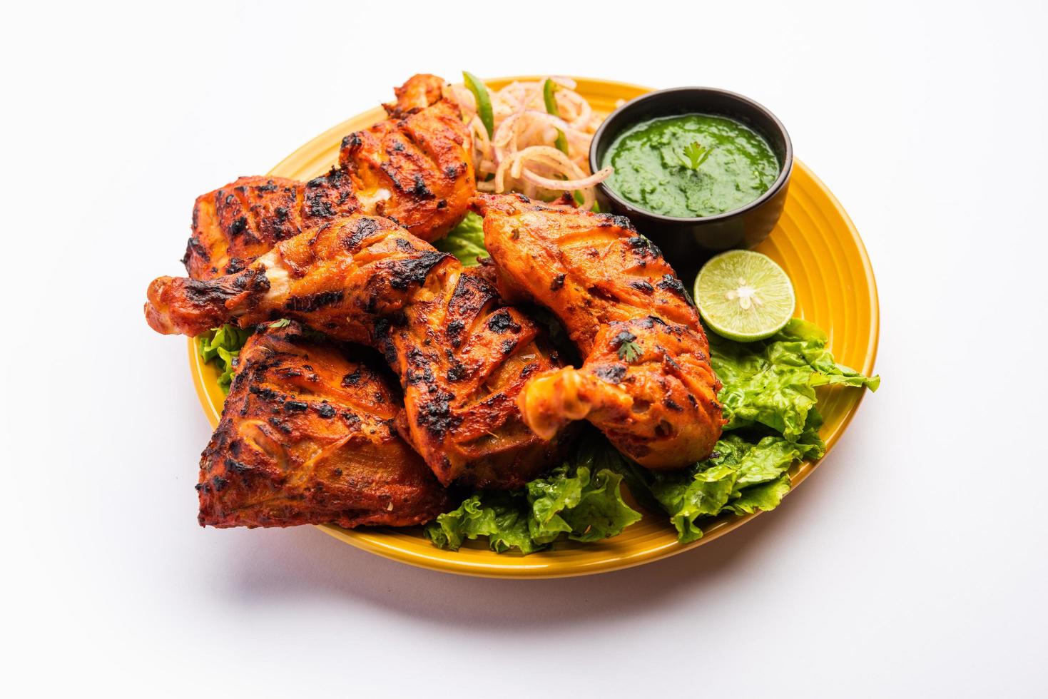 tandoori pollo è un indiano non vegetariano speziato cibo foto