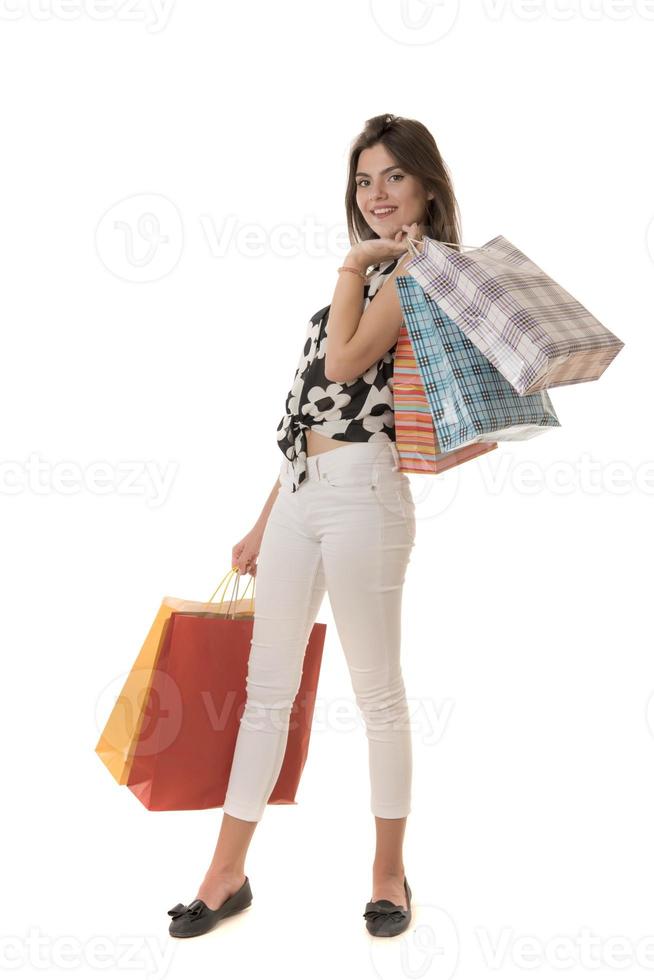 giovane moderno bellissimo donna con un' lotto di shopping borse foto