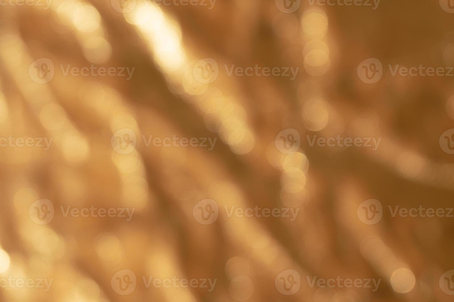 astratto su di messa a fuoco d'oro sfocato metallico sfondo foto