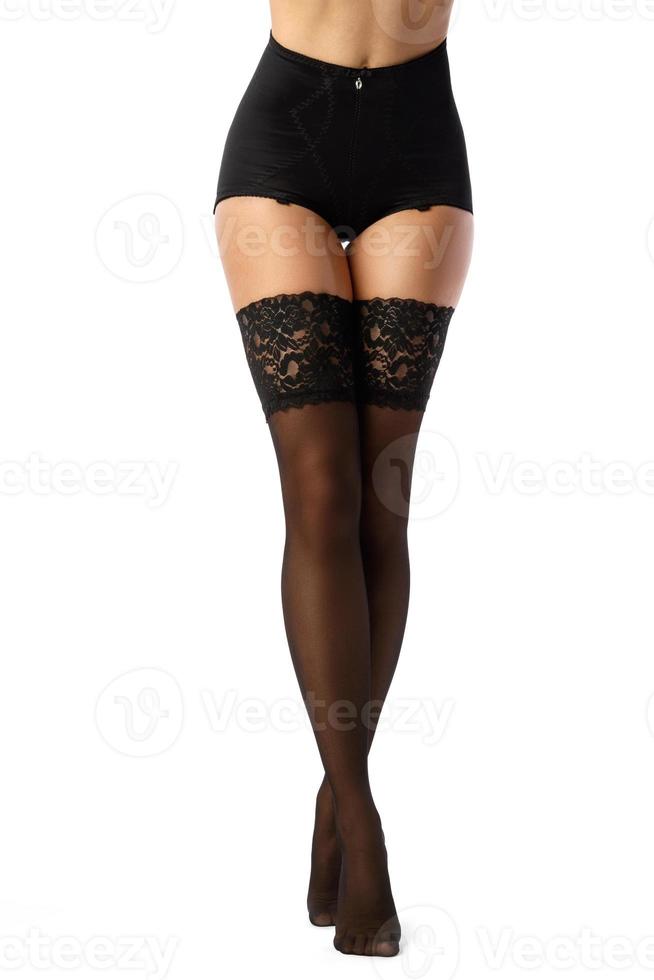 bellissimo femmina gambe nel nero calze autoreggenti foto
