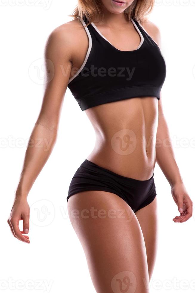 fitness ragazza con muscolare corpo in posa nel studio foto
