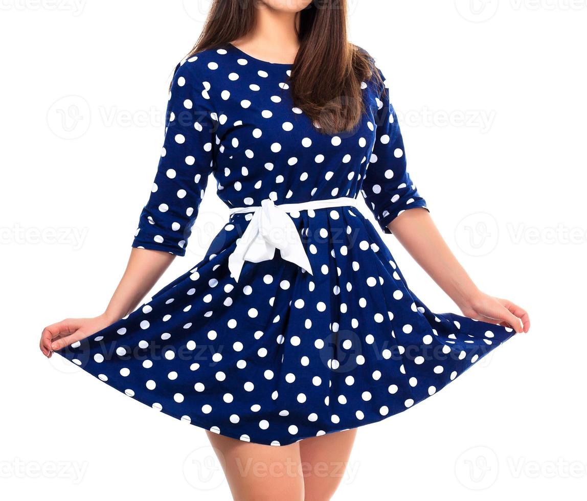 donna nel un' vestito con polka punto Stampa, isolato su bianca sfondo foto