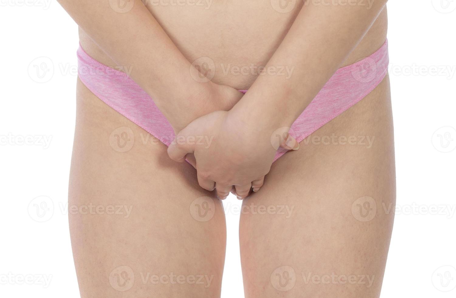 giovane donna Tenere mani su pancia a casa. ginecologia foto