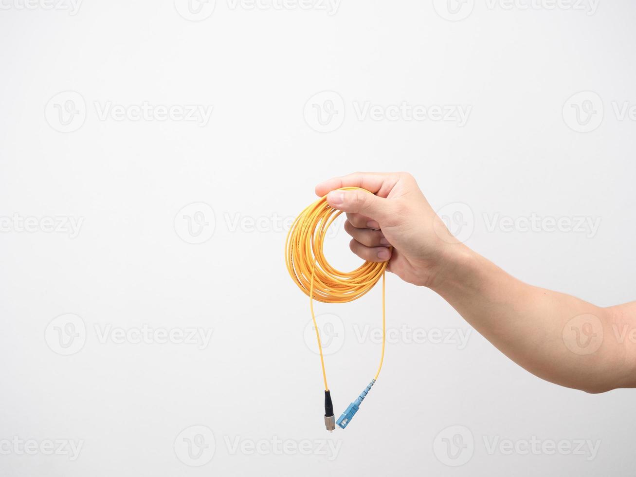 uomo mano Tenere ciclo continuo fibra ottico toppa cordone bianca isolato foto