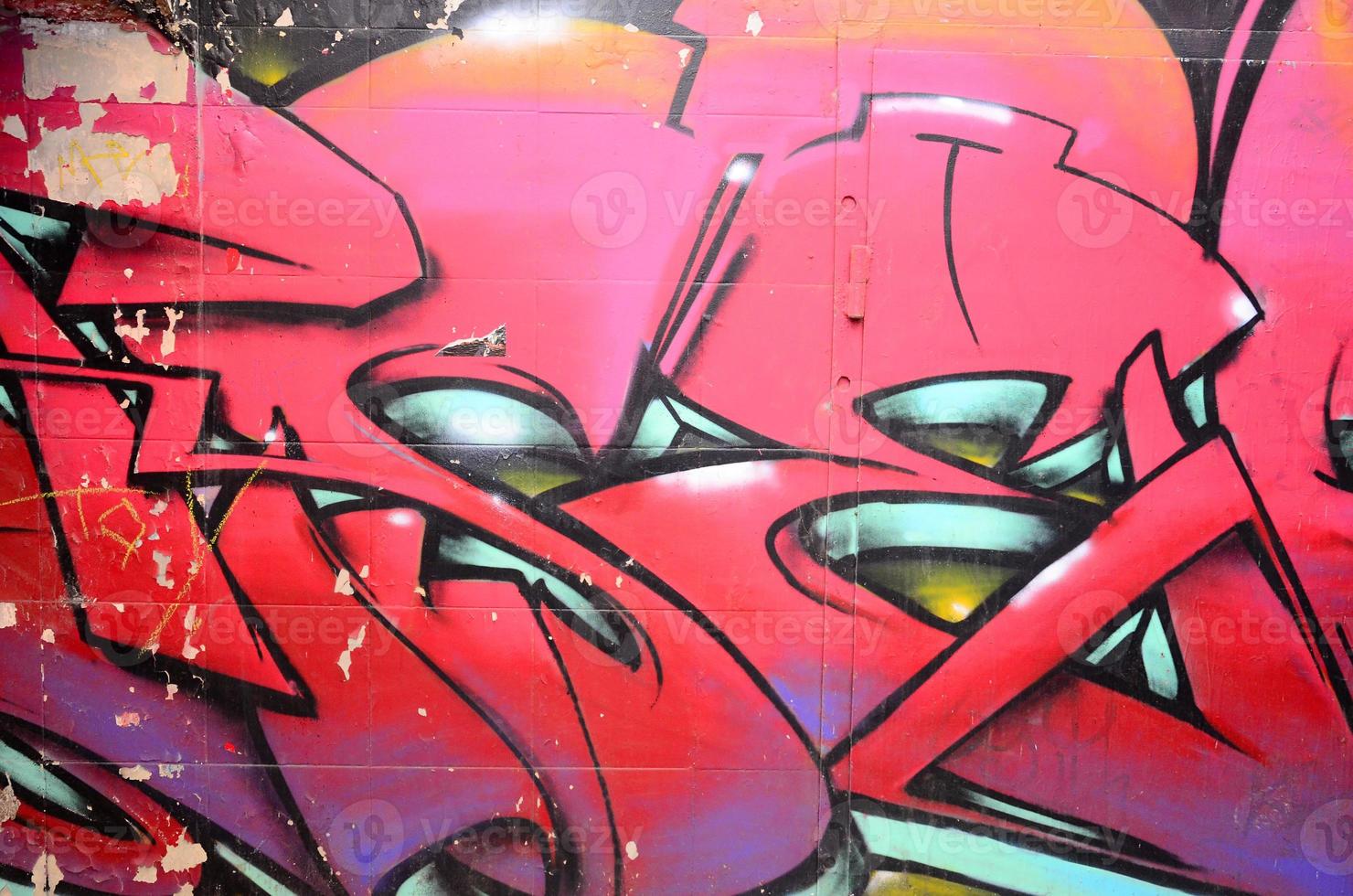 frammento di graffiti disegni. il vecchio parete decorato con dipingere macchie nel il stile di strada arte cultura. colorato sfondo struttura nel caldo toni foto