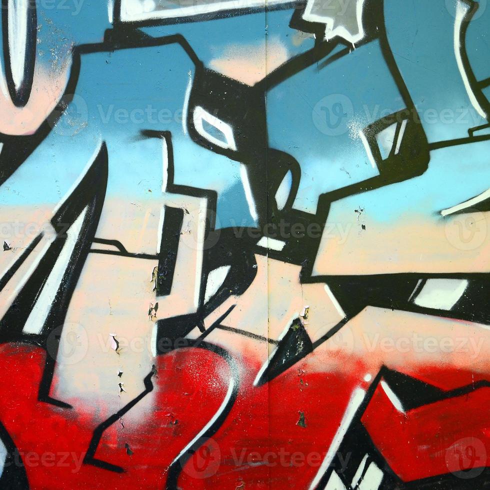 frammento di graffiti disegni. il vecchio parete decorato con dipingere macchie nel il stile di strada arte cultura. colorato sfondo struttura foto