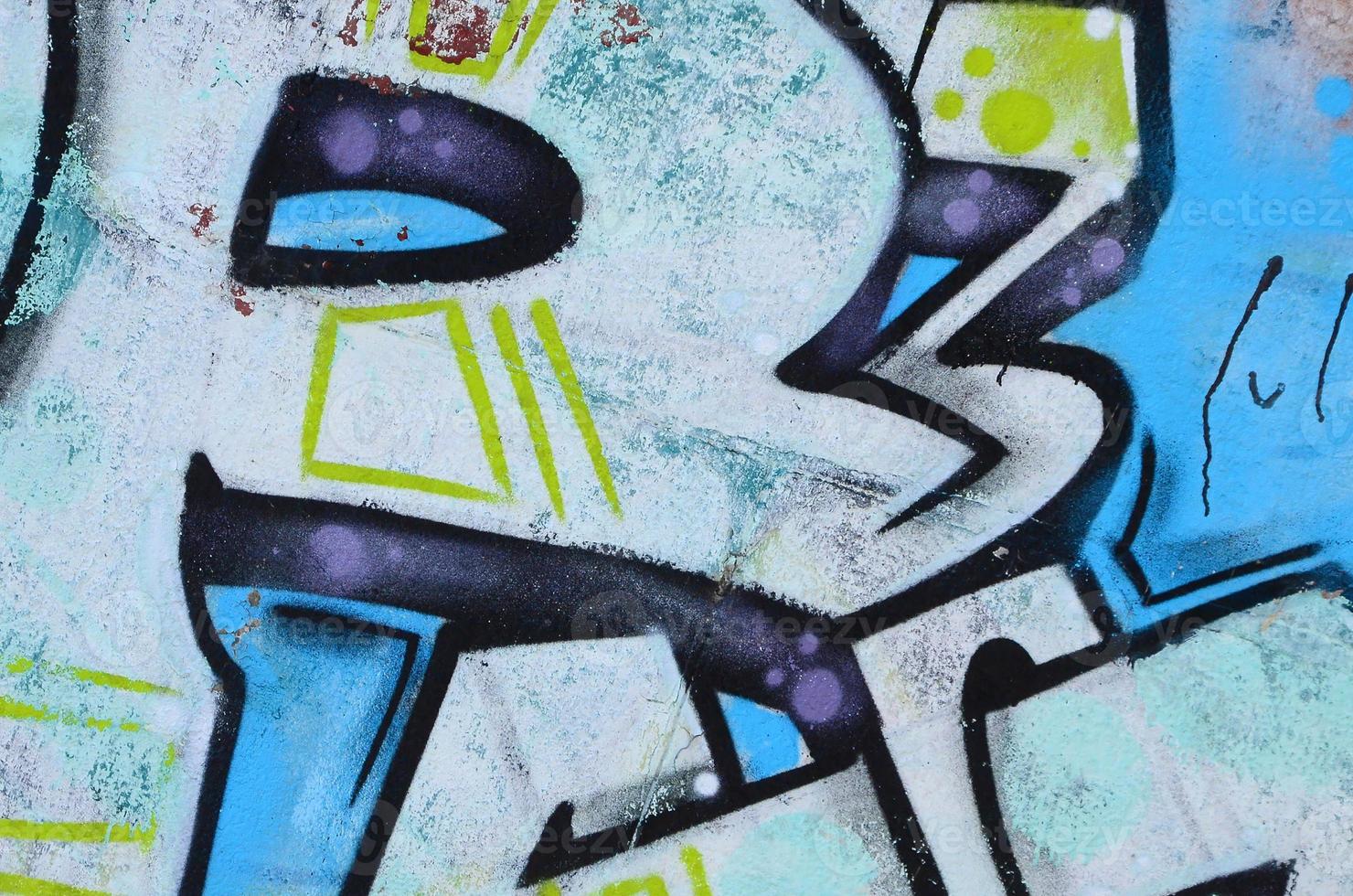 frammento di graffiti disegni. il vecchio parete decorato con dipingere macchie nel il stile di strada arte cultura. colorato sfondo struttura nel freddo toni foto