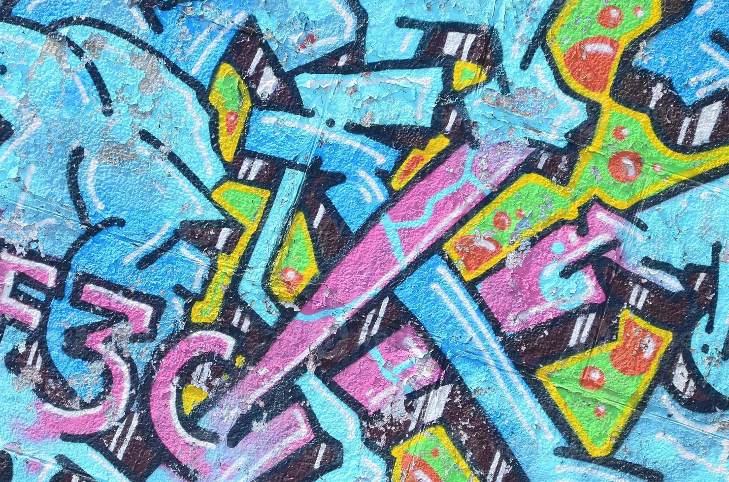 frammento di graffiti disegni. il vecchio parete decorato con dipingere macchie nel il stile di strada arte cultura. colorato sfondo struttura nel freddo toni foto