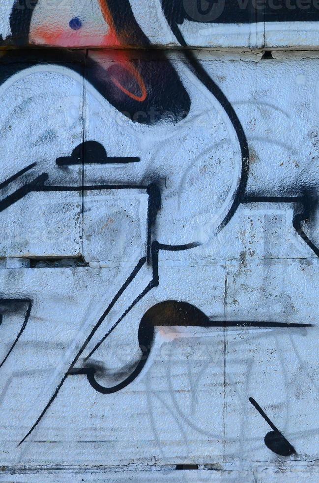 frammento di graffiti disegni. il vecchio parete decorato con dipingere macchie nel il stile di strada arte cultura. colorato sfondo struttura foto