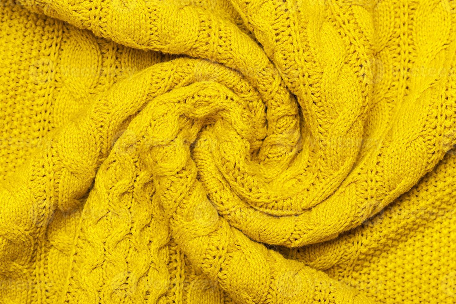 luminosa giallo macro foto di strutturato maglia e maglieria di maglione o felpa. modello e sfondo per moda caldo autunno concetto