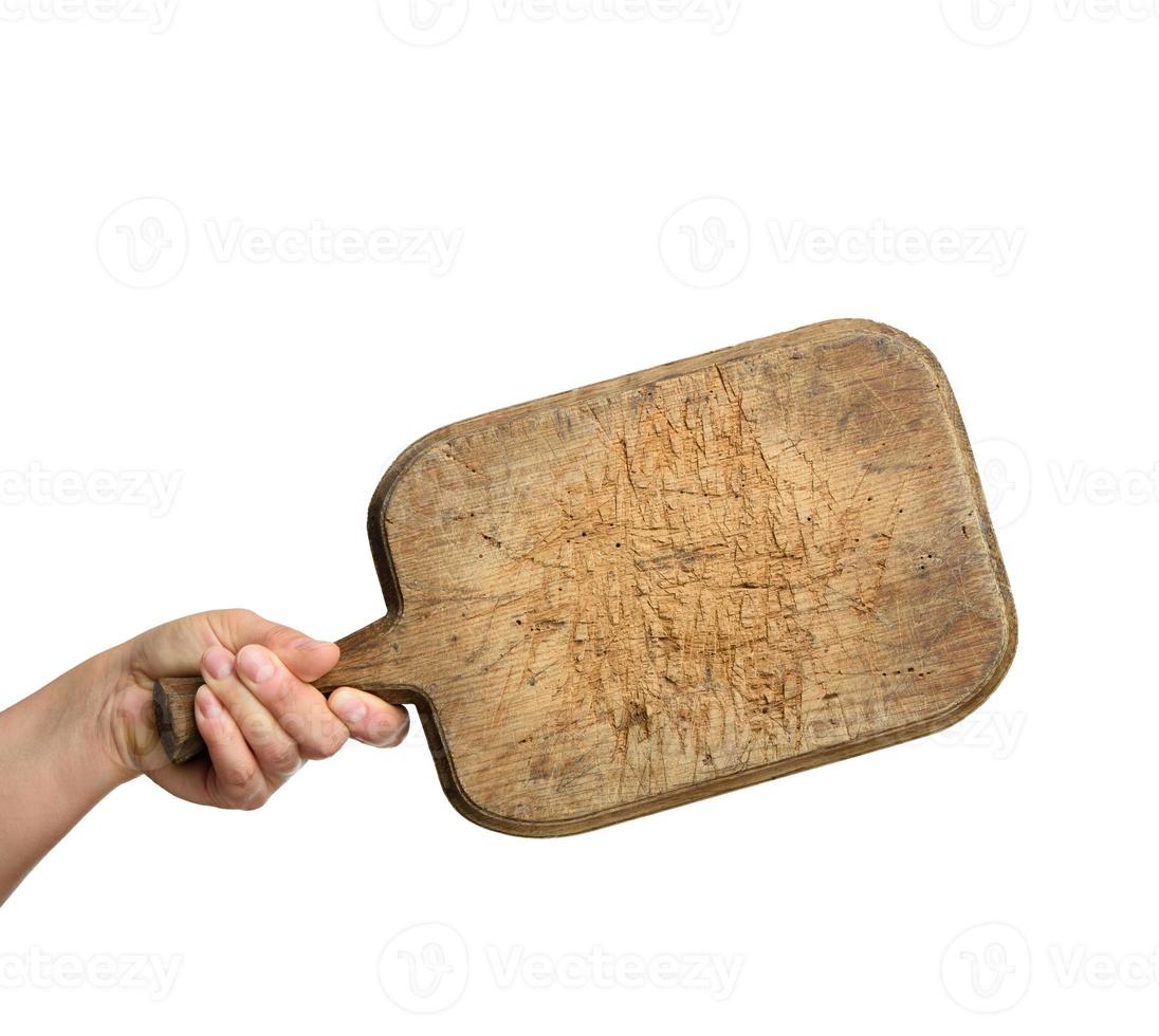 donna Tenere vuoto Marrone rettangolare di legno tavola nel mano foto