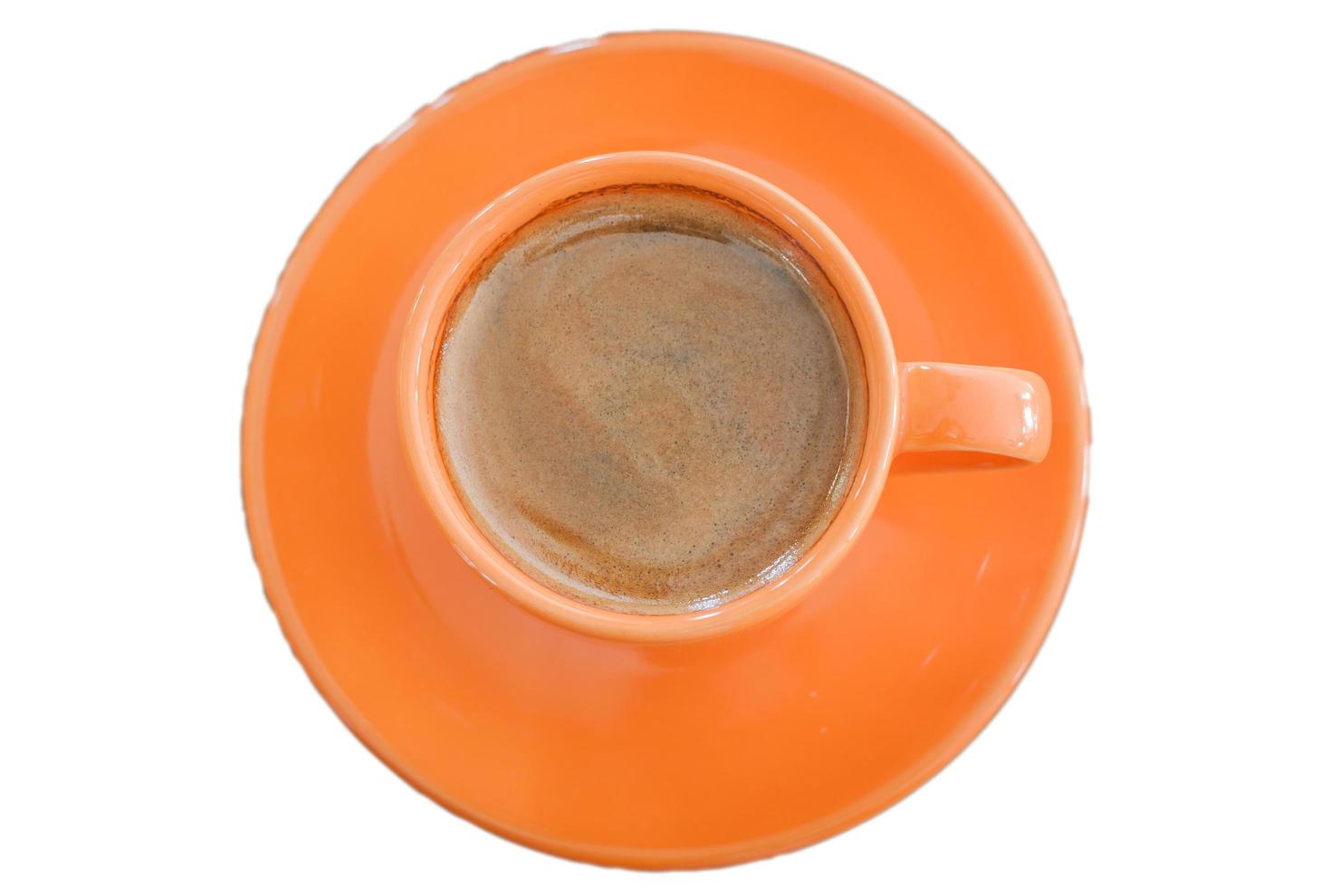 vista dall'alto di una tazza di caffè arancione foto