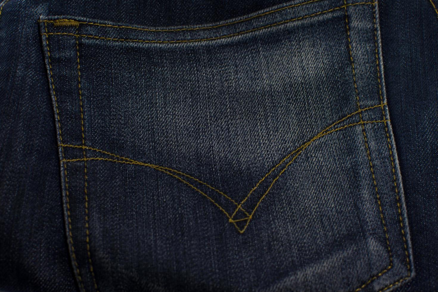 trama della tasca dei jeans da vicino, sfondo. foto